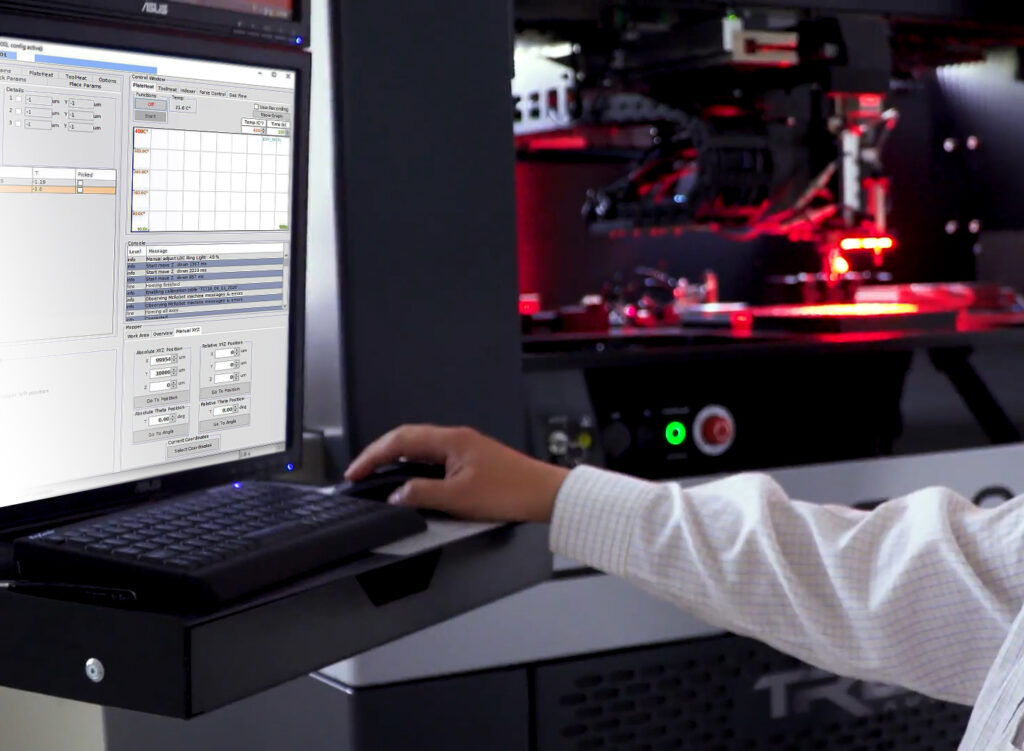 picture: man controls the Tresky DIE Bonder with a Computer